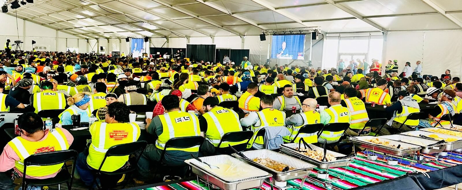 Large tented dining hall set up for a jobsite workforce.